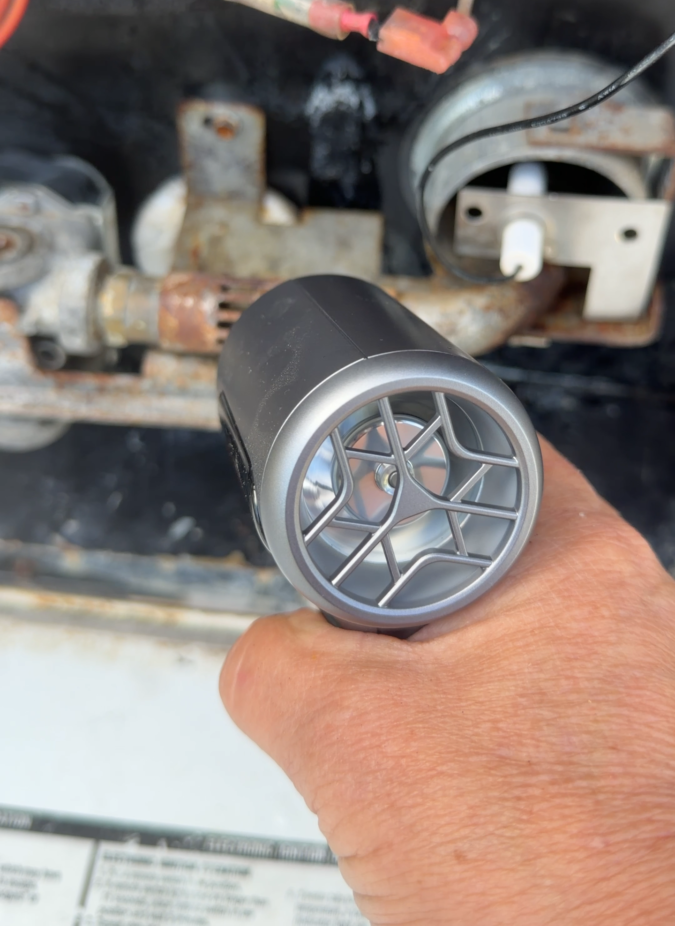 Wolfbox MegaFlow 200 cleaning an RV water heater